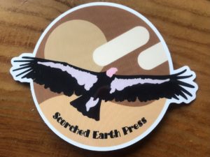 vinyl sticker of a condor with outstretched wings on a wooden table